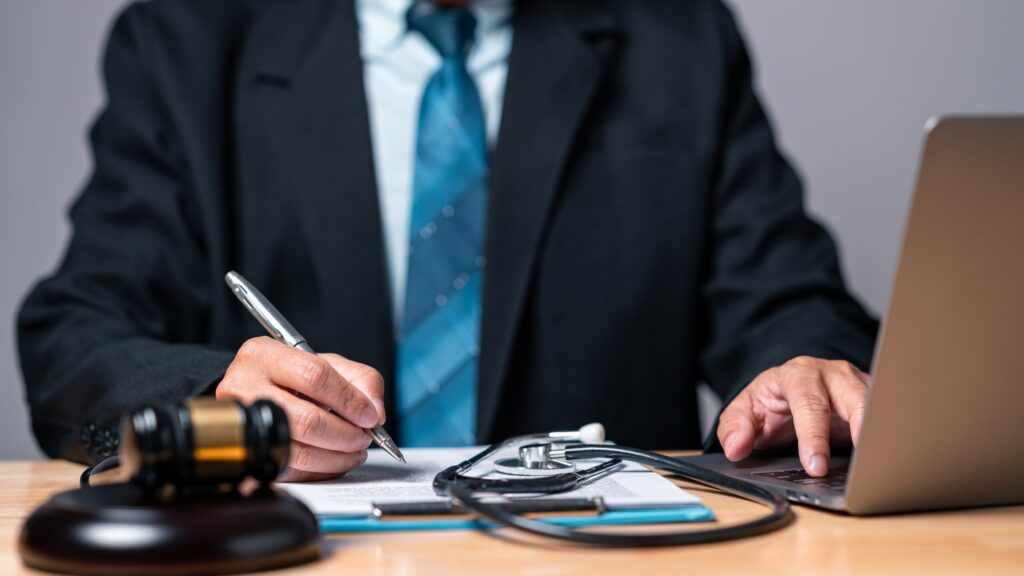 Fearless personal injury attorney reviewing legal documents to protect accident victims&rsquo; rights in Mississippi.