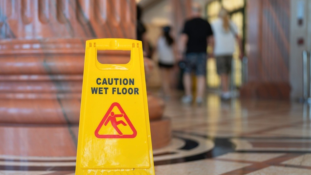 Caution wet floor sign warning of a slip and fall hazard in Columbus